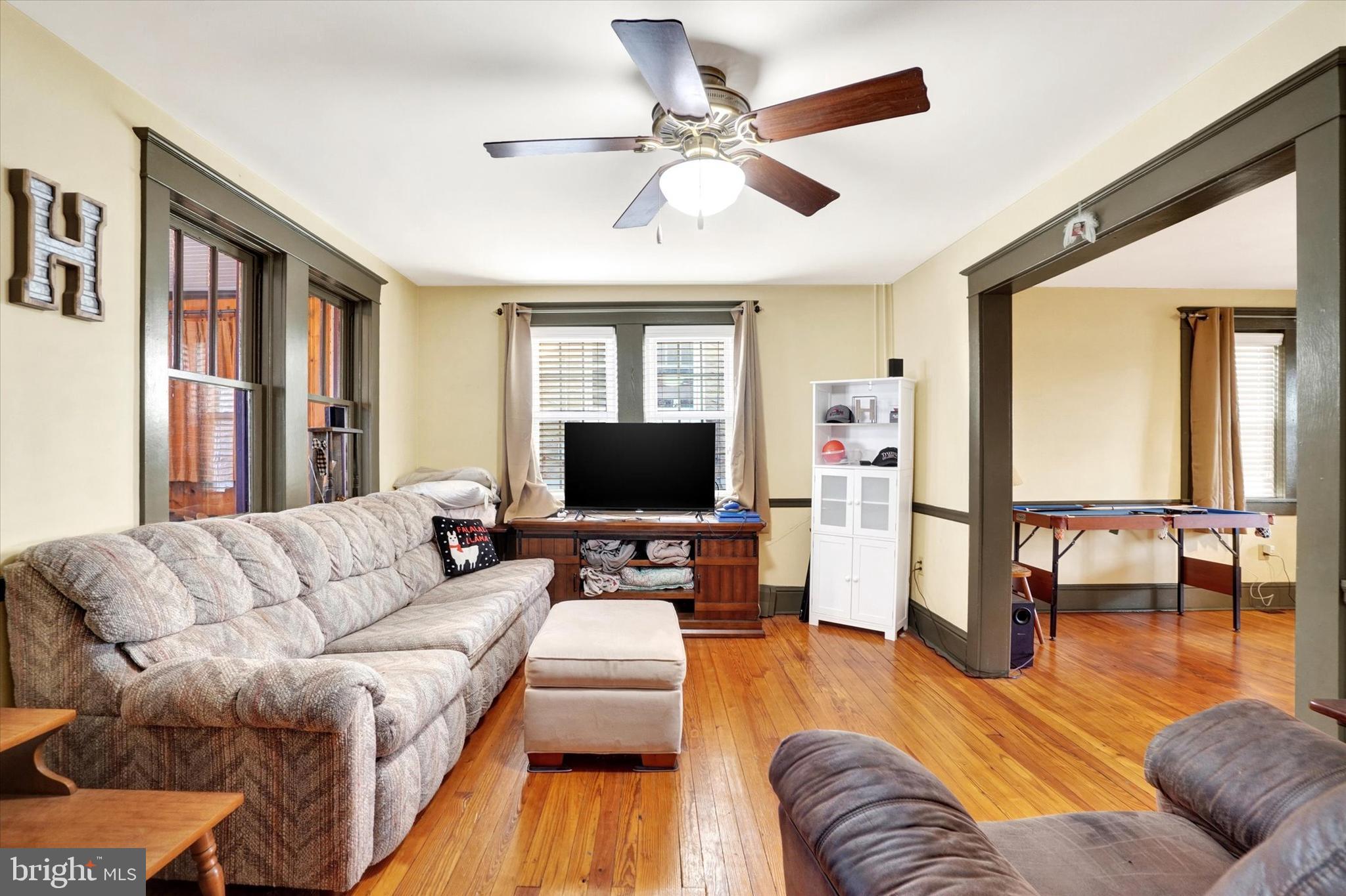 370 East Market Street York, PA 17406 - Photo 5 of 27 a living room with furniture flat screen tv and a large window