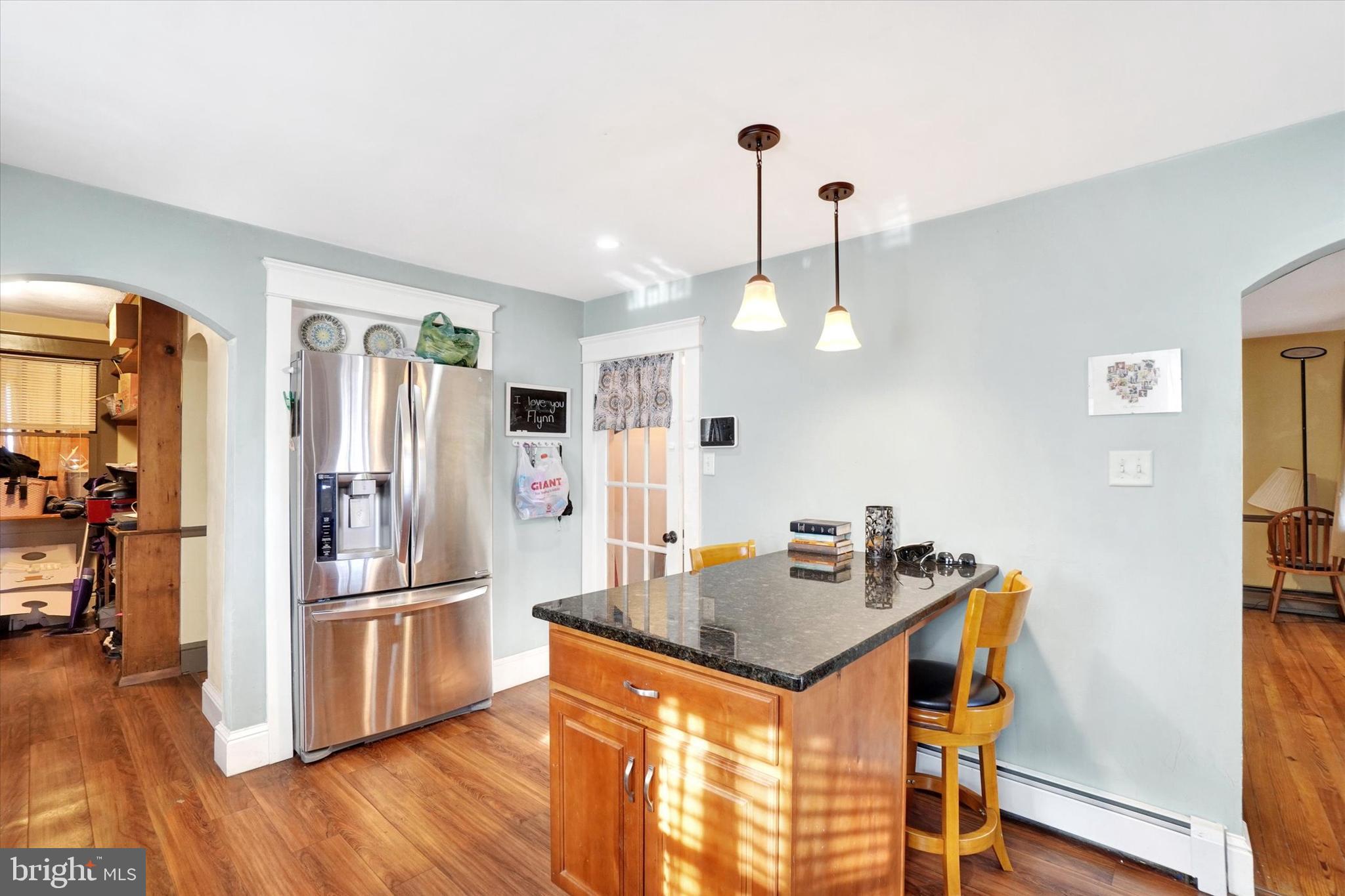370 East Market Street York, PA 17406 - Photo 10 of 27 a kitchen with stainless steel appliances granite countertop a refrigerator a stove and a wooden floors