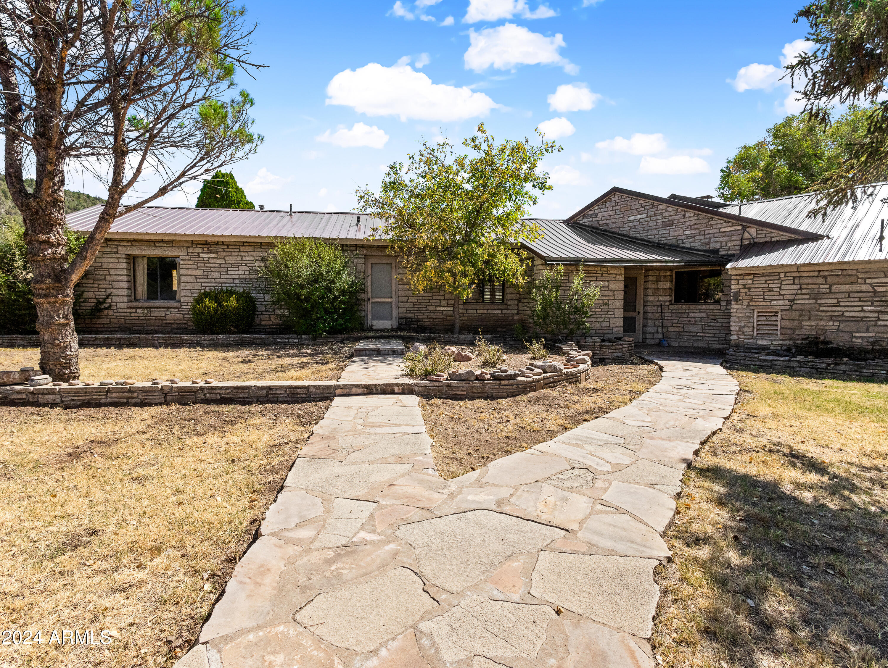 4820 East Perkinsville Road Chino Valley, AZ 86323 - Photo 30 of 128 a view of a swimming pool with a patio