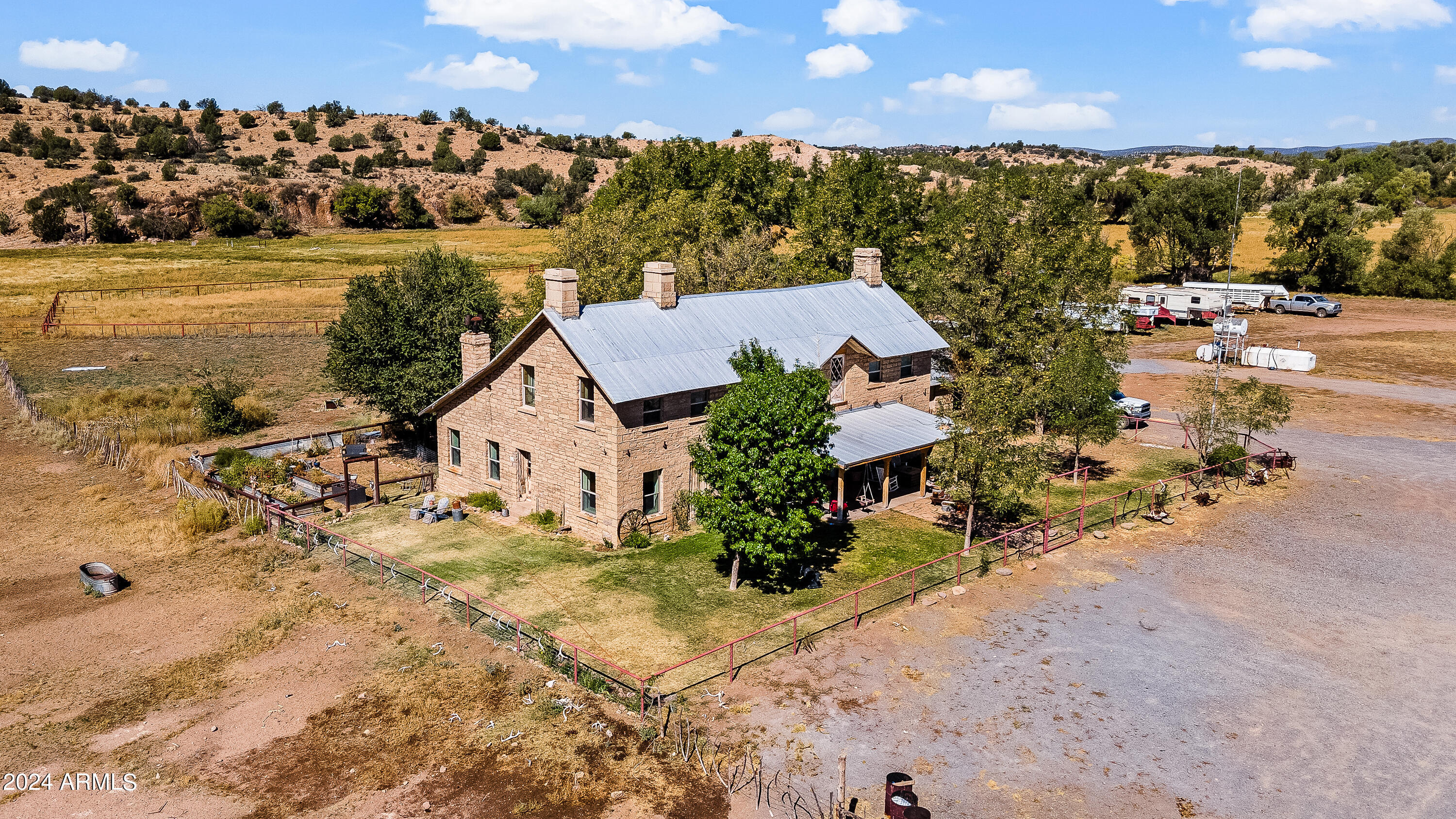 4820 East Perkinsville Road Chino Valley, AZ 86323 - Photo 4 of 128 an aerial view of a house with a lake view