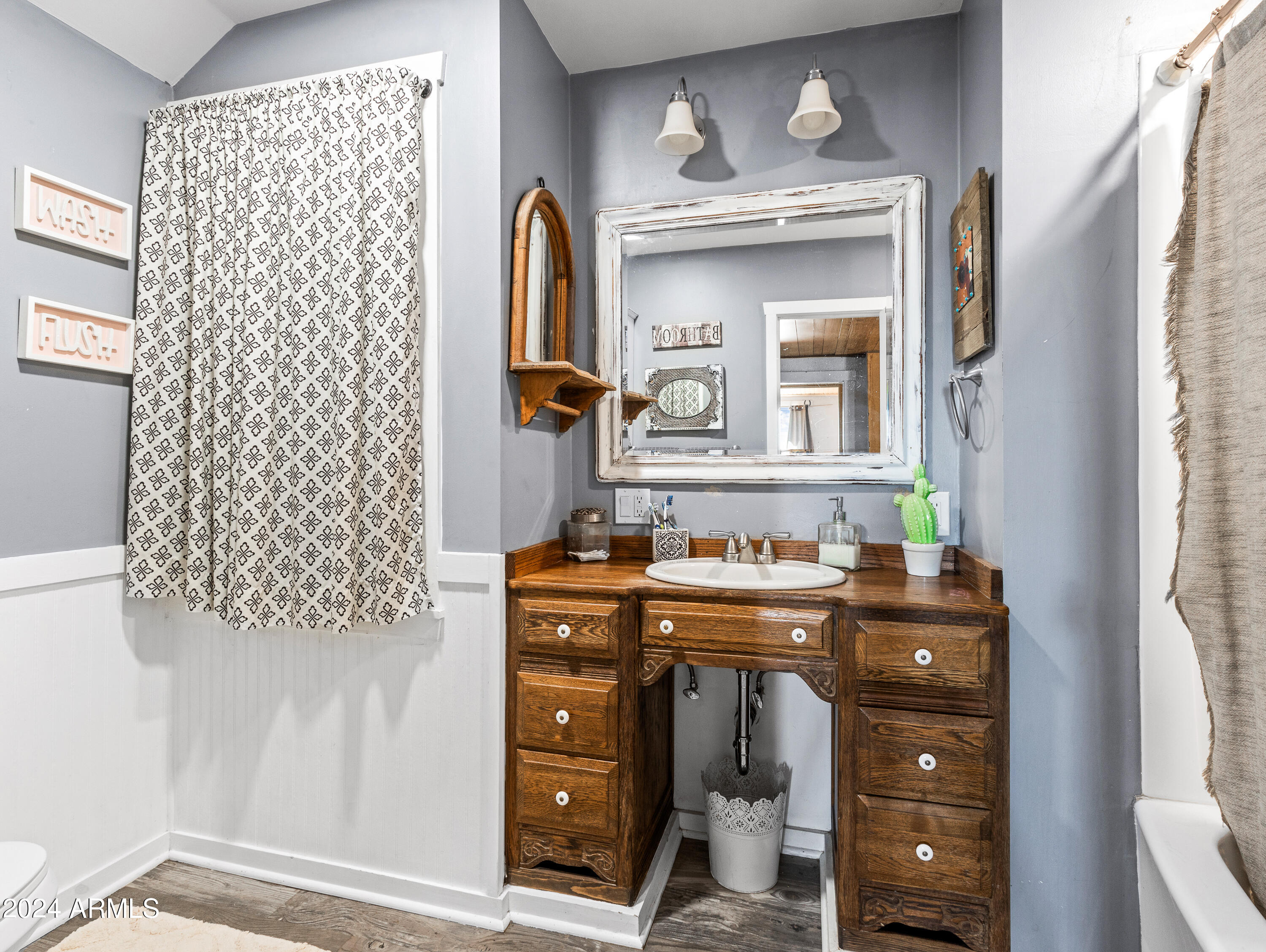 4820 East Perkinsville Road Chino Valley, AZ 86323 - Photo 54 of 128 a view of a bathroom with a sink and a mirror