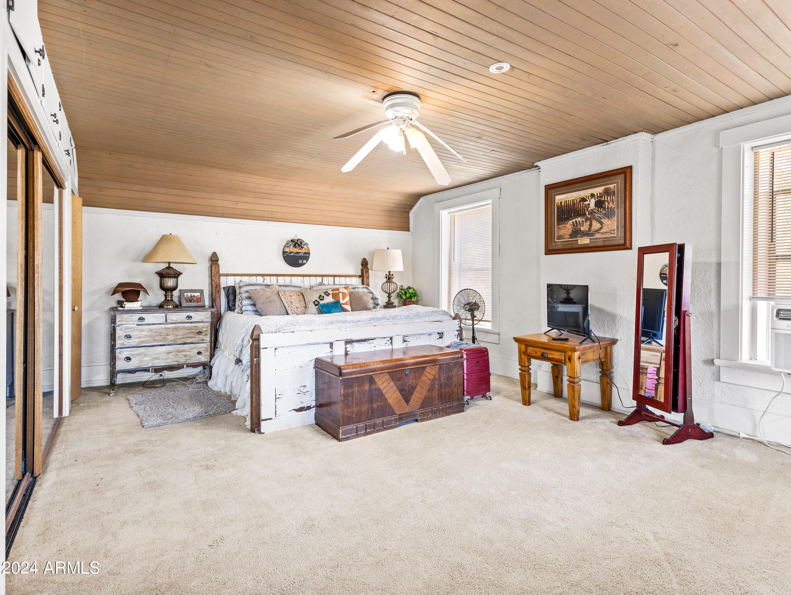 4820 East Perkinsville Road Chino Valley, AZ 86323 - Photo 55 of 128 a bedroom with furniture and a flat screen tv