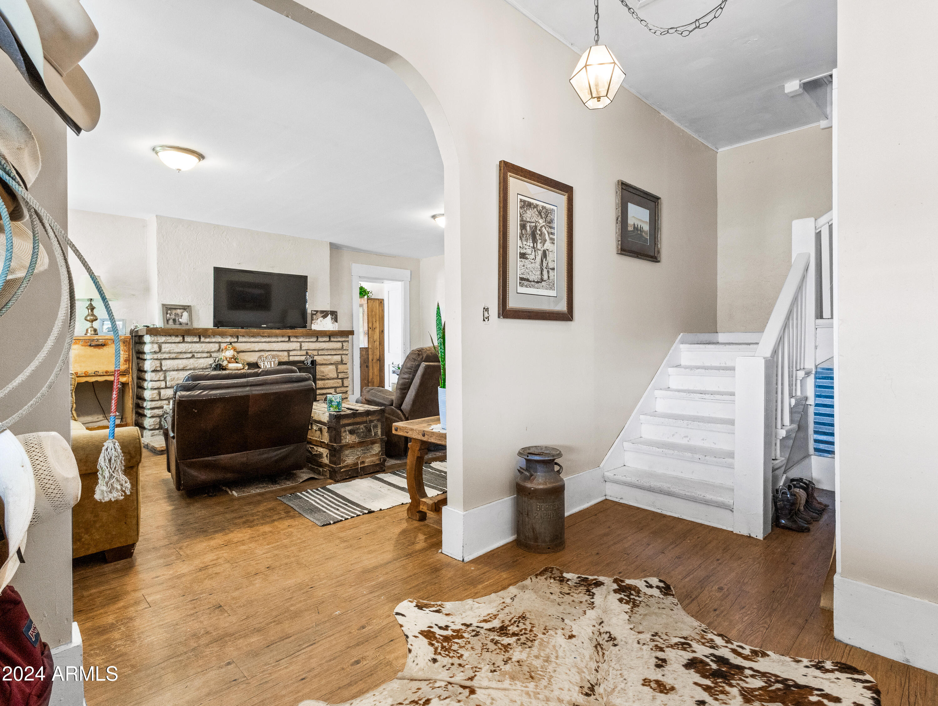 4820 East Perkinsville Road Chino Valley, AZ 86323 - Photo 68 of 128 a living room with furniture and a fireplace