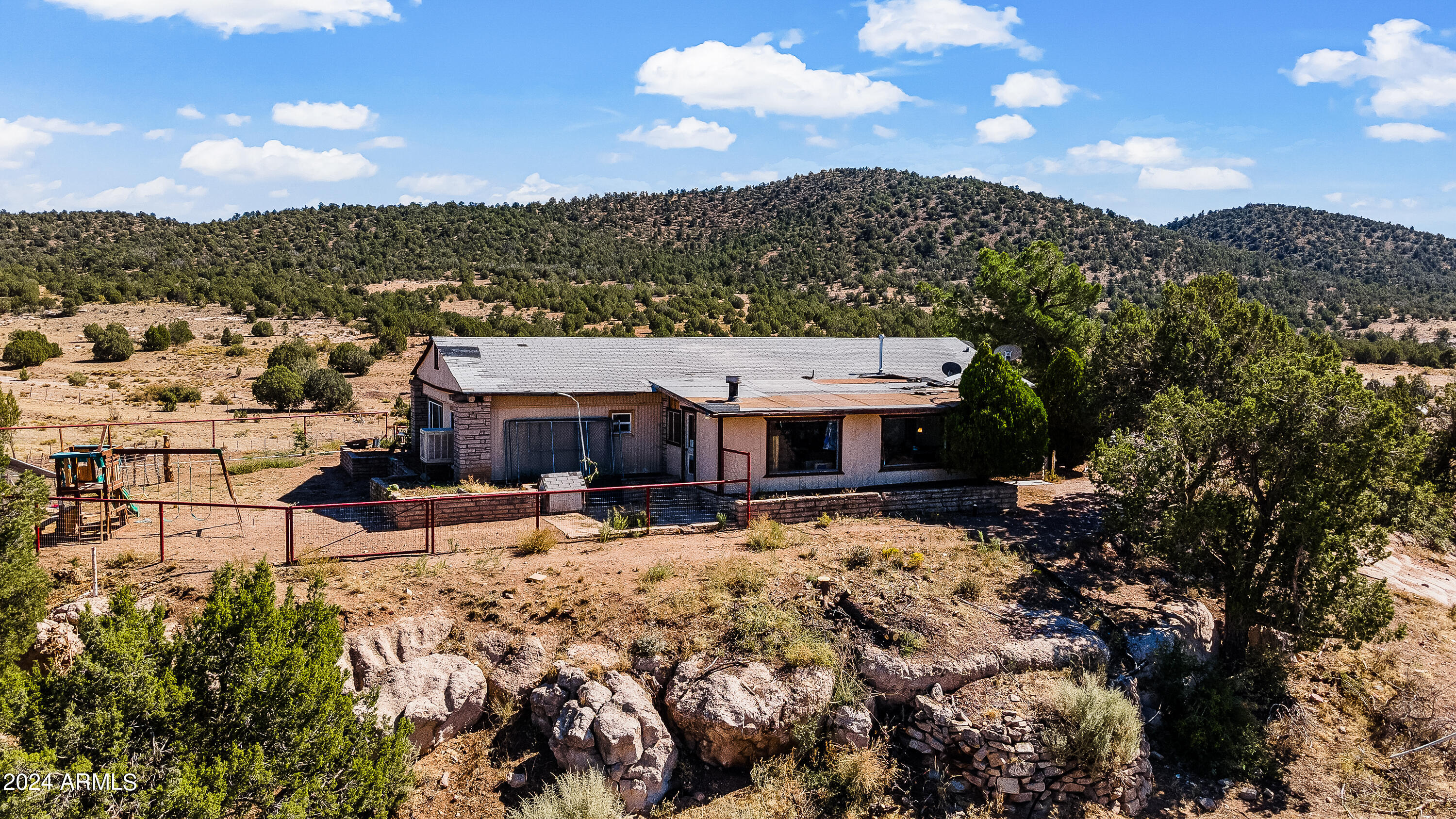 4820 East Perkinsville Road Chino Valley, AZ 86323 - Photo 80 of 128 a view of a house with a yard