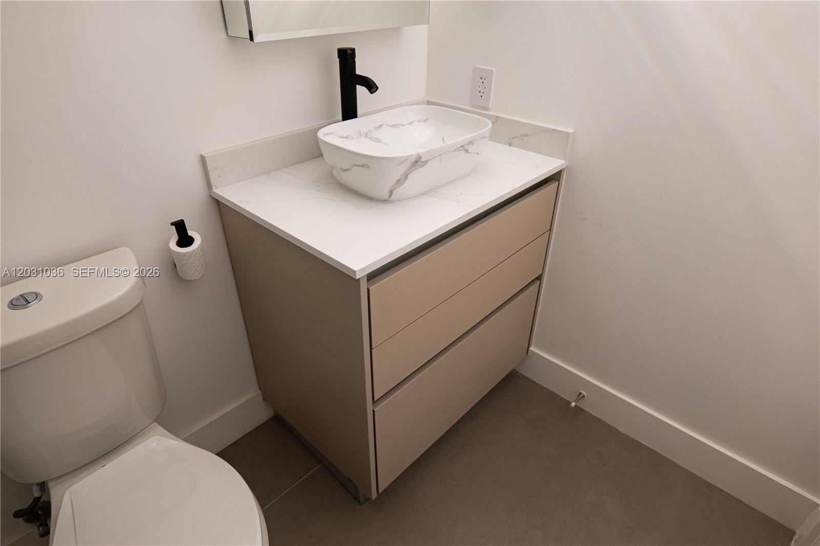 1721 Southwest 13th Street, Unit 4 Miami, FL 33145 - Photo 14 of 24 a bathroom with a sink toilet and mirror
