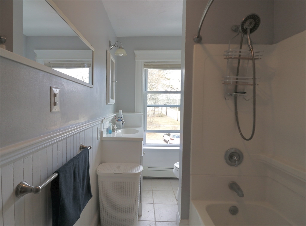 126 Summer Street, Unit 2 Kingston, MA 02364 - Photo 13 of 16 a bathroom with a sink a toilet and shower
