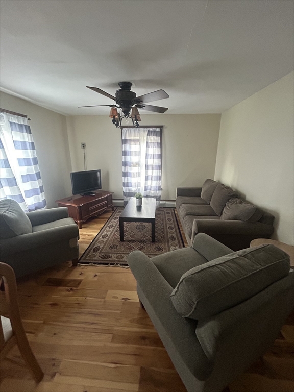 126 Summer Street, Unit 2 Kingston, MA 02364 - Photo 2 of 16 a living room with furniture and a window