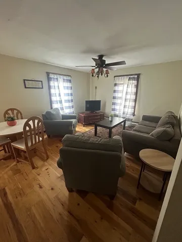 a living room with furniture and a window