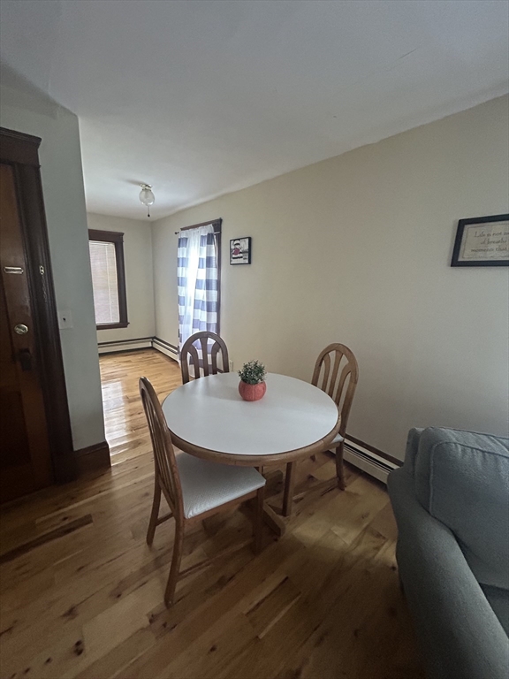 126 Summer Street, Unit 2 Kingston, MA 02364 - Photo 4 of 16 a view of a dining room with furniture and wooden floor