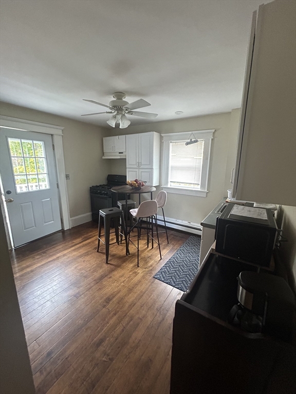 126 Summer Street, Unit 2 Kingston, MA 02364 - Photo 5 of 16 a living room with furniture and wooden floor