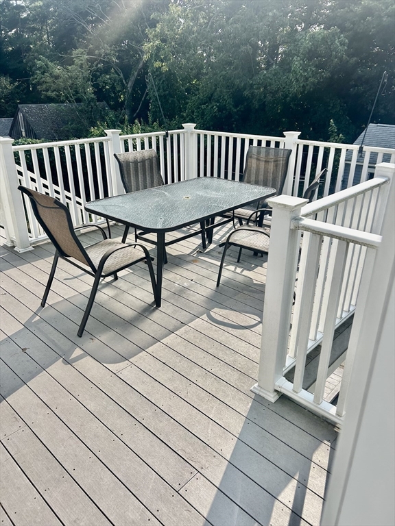 126 Summer Street, Unit 2 Kingston, MA 02364 - Photo 9 of 16 a view of balcony with wooden floor and outdoor seating