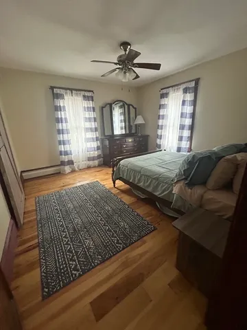 a bedroom with bed and window