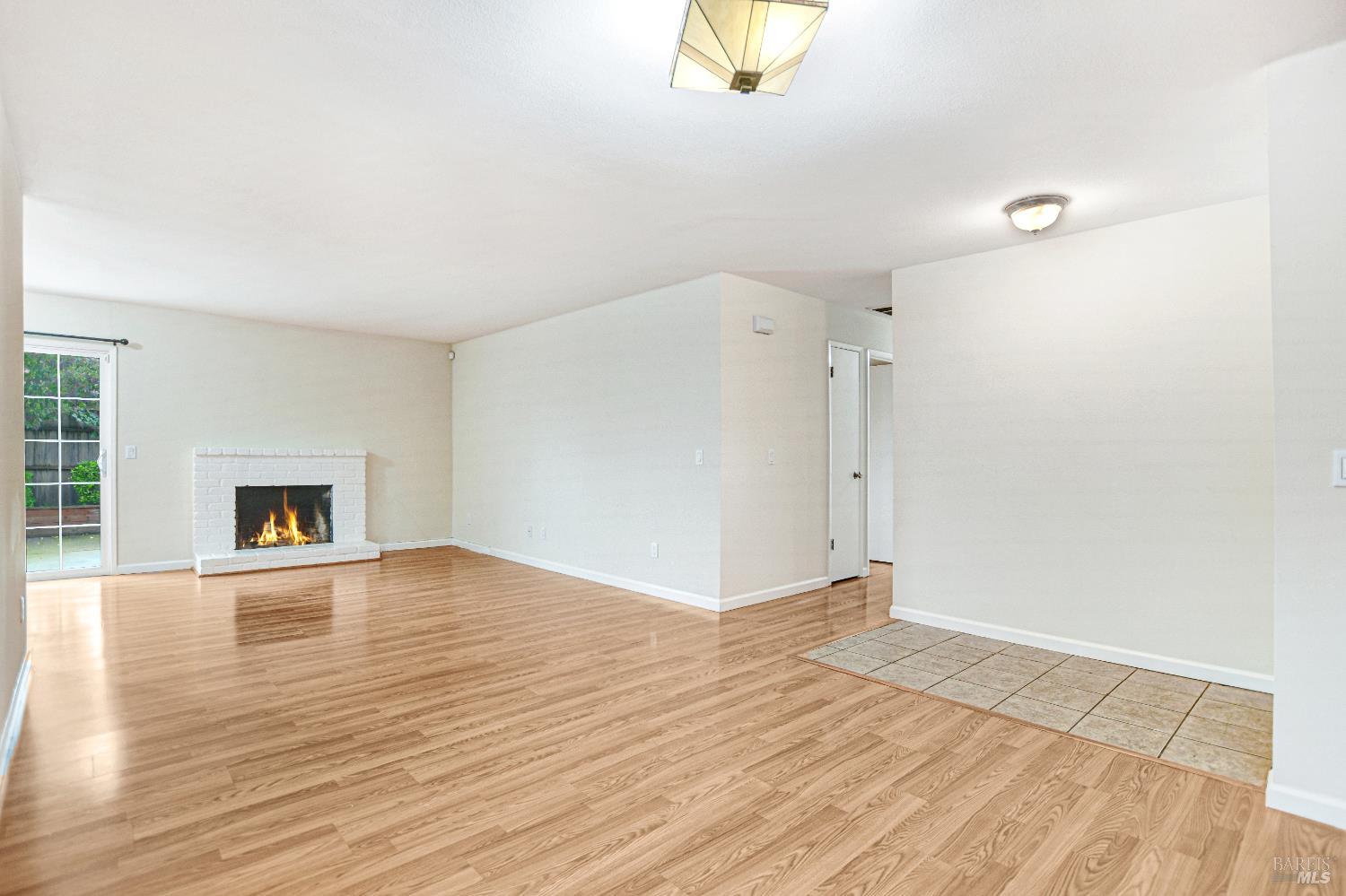 7257 Belita Avenue Rohnert Park, CA 94928 - Photo 11 of 37 a view of empty room with wooden floor and fan