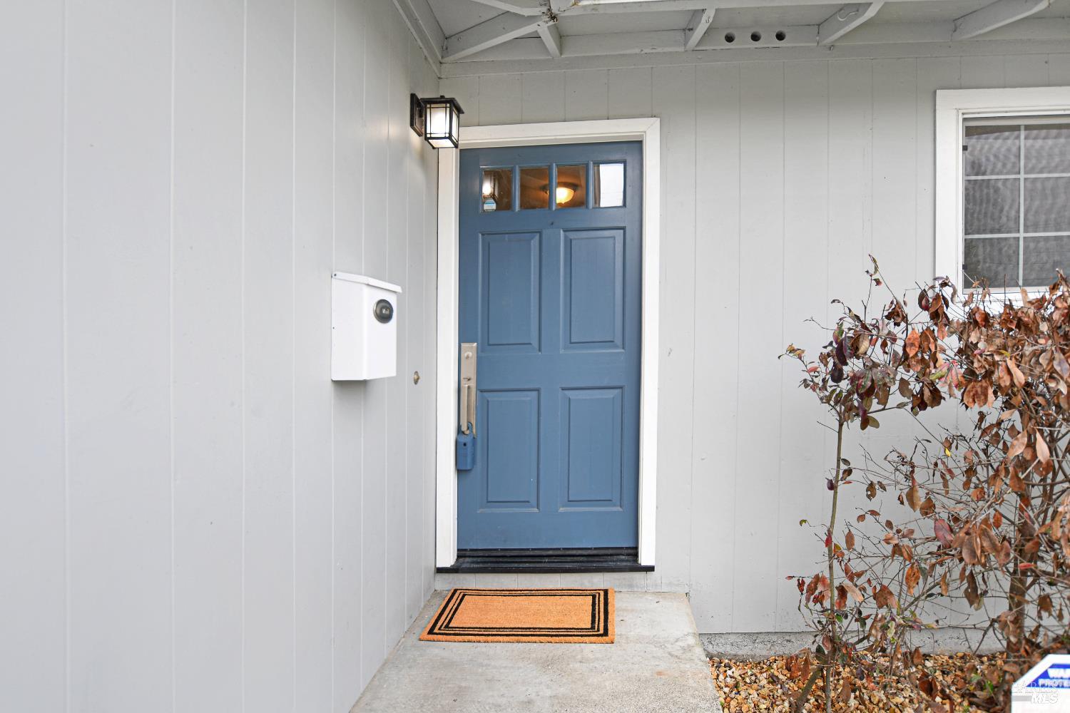 7257 Belita Avenue Rohnert Park, CA 94928 - Photo 14 of 37 a view of a hallway with wooden floor and a potted plant