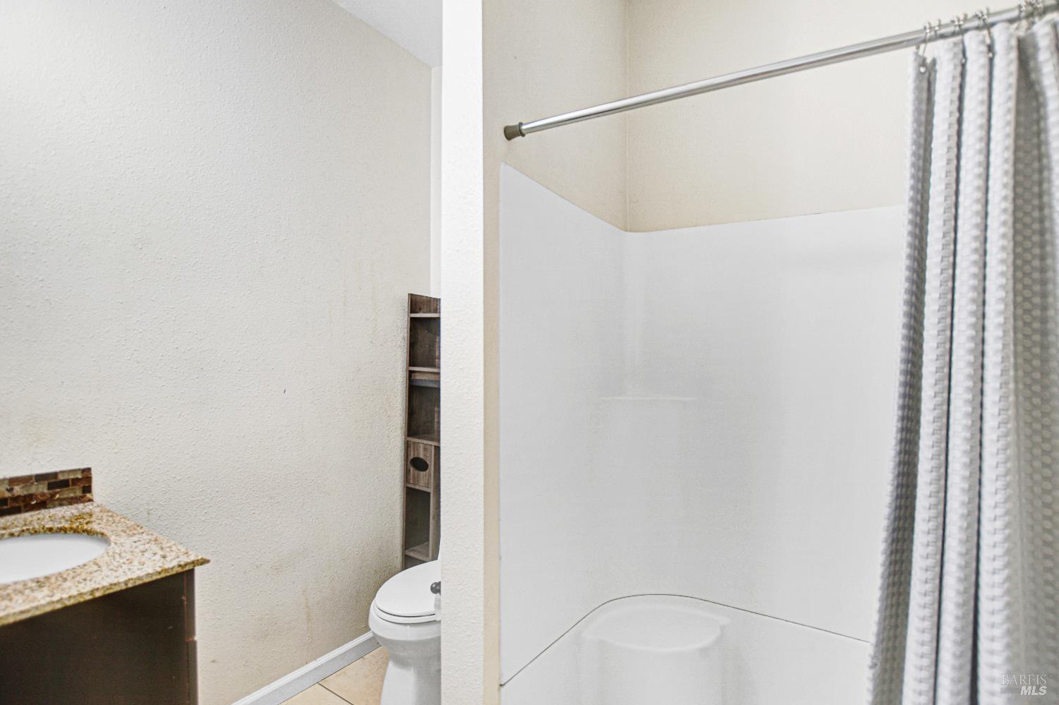 7257 Belita Avenue Rohnert Park, CA 94928 - Photo 19 of 37 a bathroom with a sink and a mirror