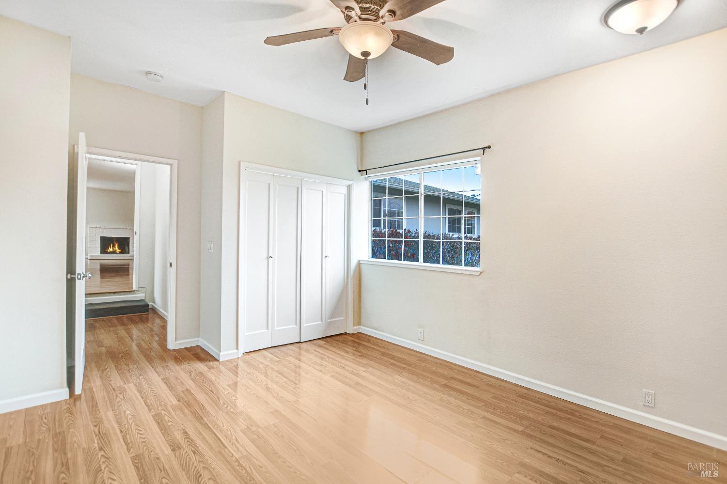 7257 Belita Avenue Rohnert Park, CA 94928 - Photo 22 of 37 wooden floor in an empty room with a window