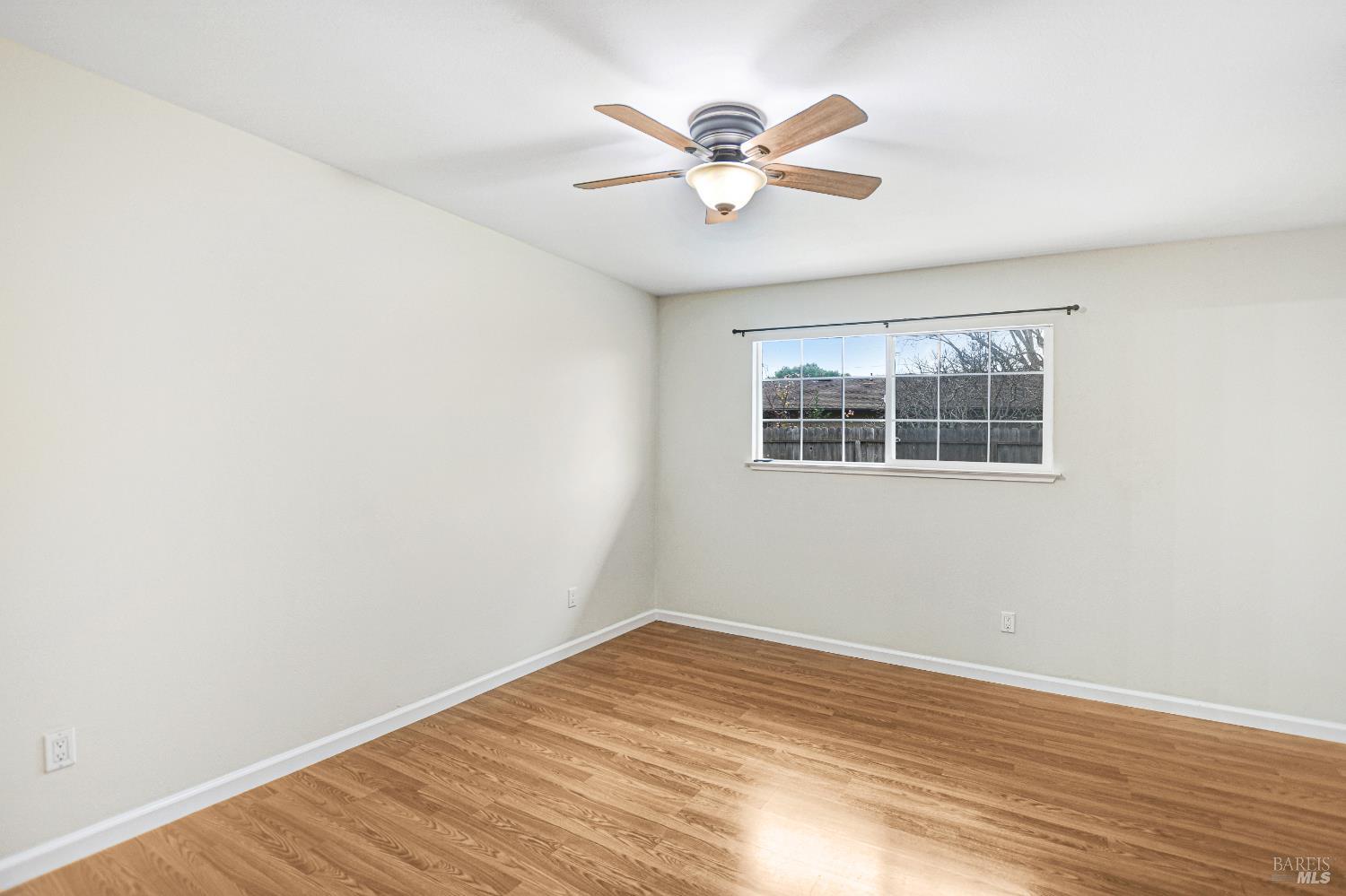7257 Belita Avenue Rohnert Park, CA 94928 - Photo 31 of 37 a view of a big room with wooden floor and windows