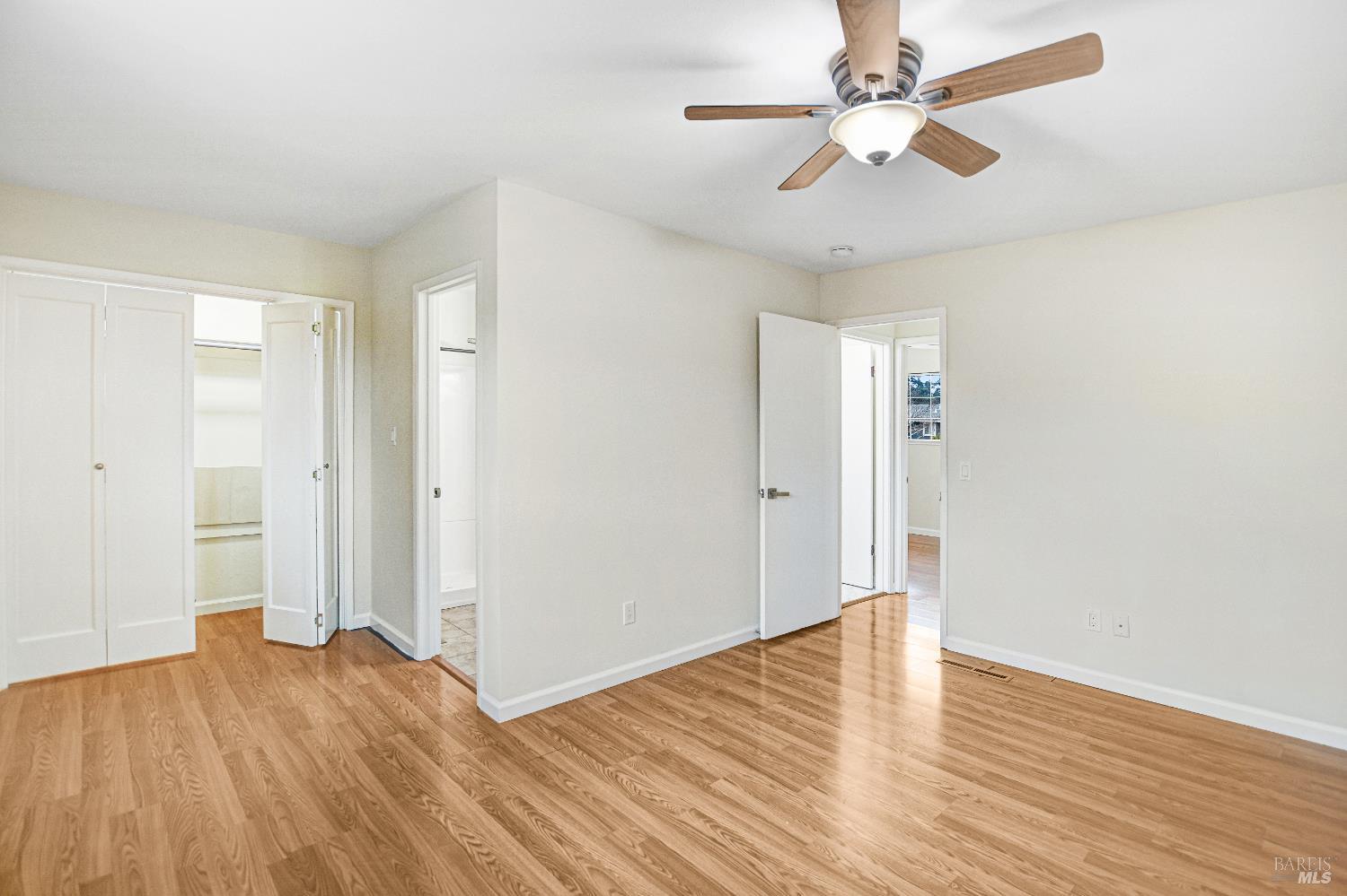 7257 Belita Avenue Rohnert Park, CA 94928 - Photo 32 of 37 an empty room with wooden floor and ceiling fan