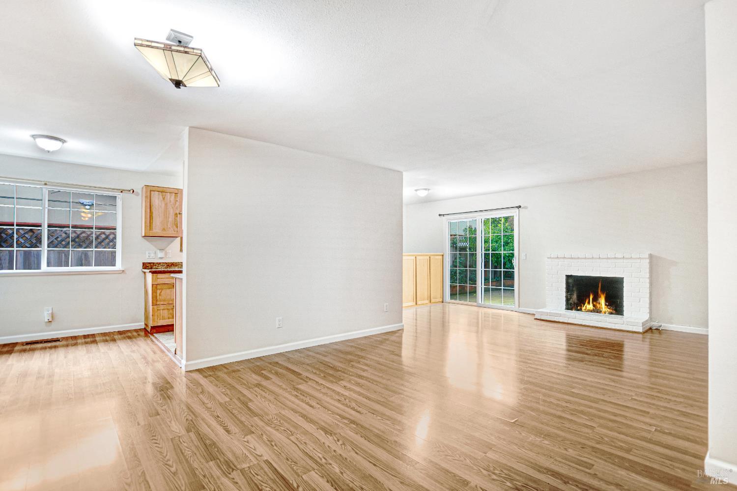 7257 Belita Avenue Rohnert Park, CA 94928 - Photo 5 of 37 wooden floor in an empty room with a window