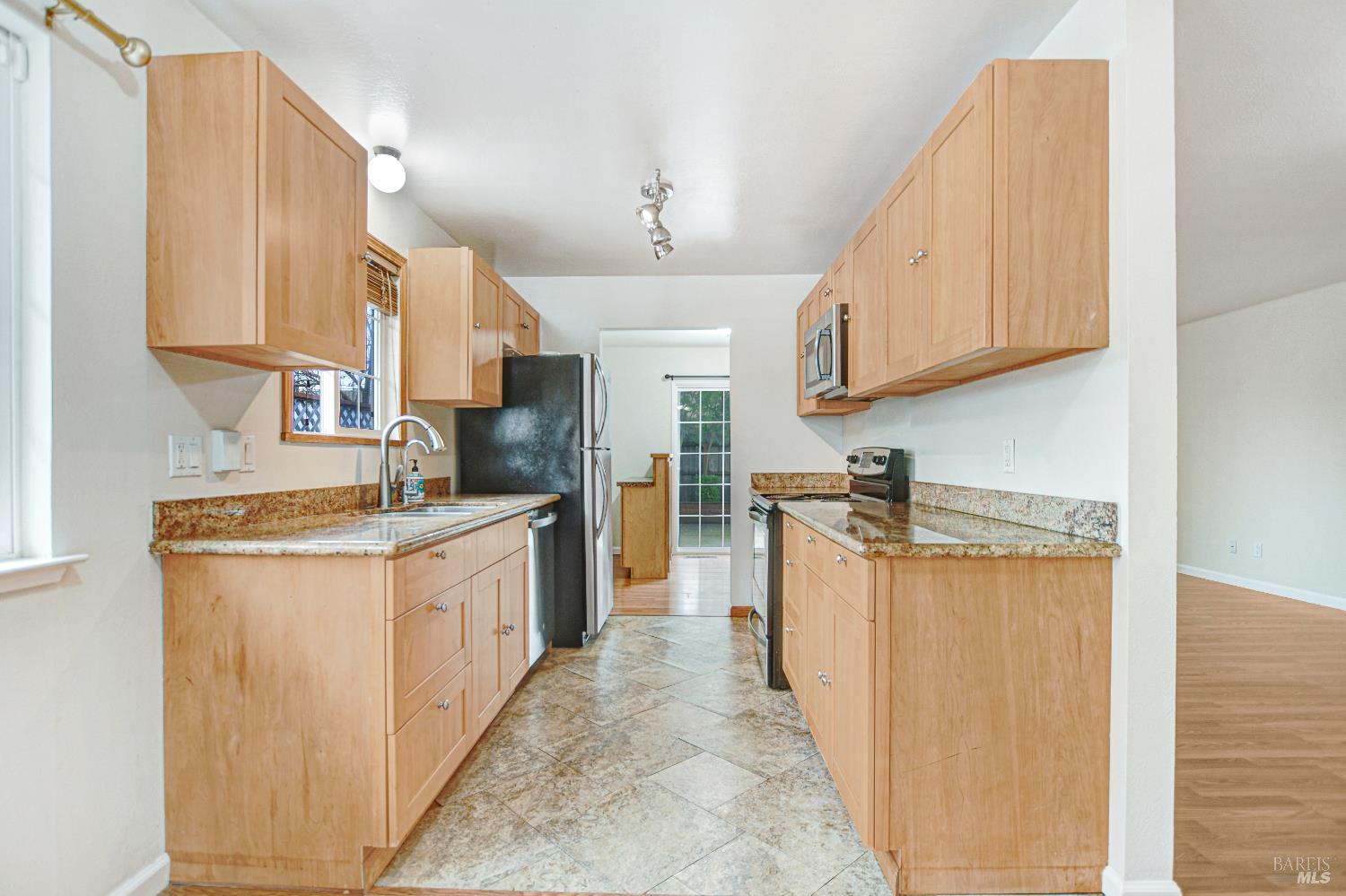 7257 Belita Avenue Rohnert Park, CA 94928 - Photo 6 of 37 a kitchen with stainless steel appliances granite countertop a stove a sink dishwasher and a refrigerator