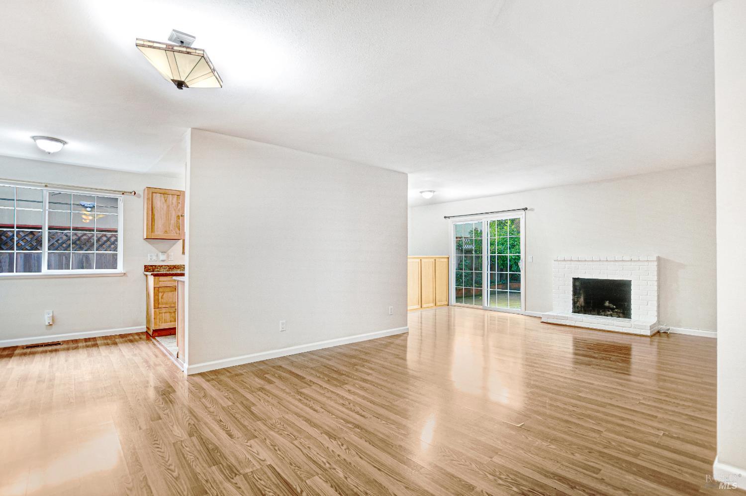 7257 Belita Avenue Rohnert Park, CA 94928 - Photo 9 of 37 a view of empty room with wooden floor and window