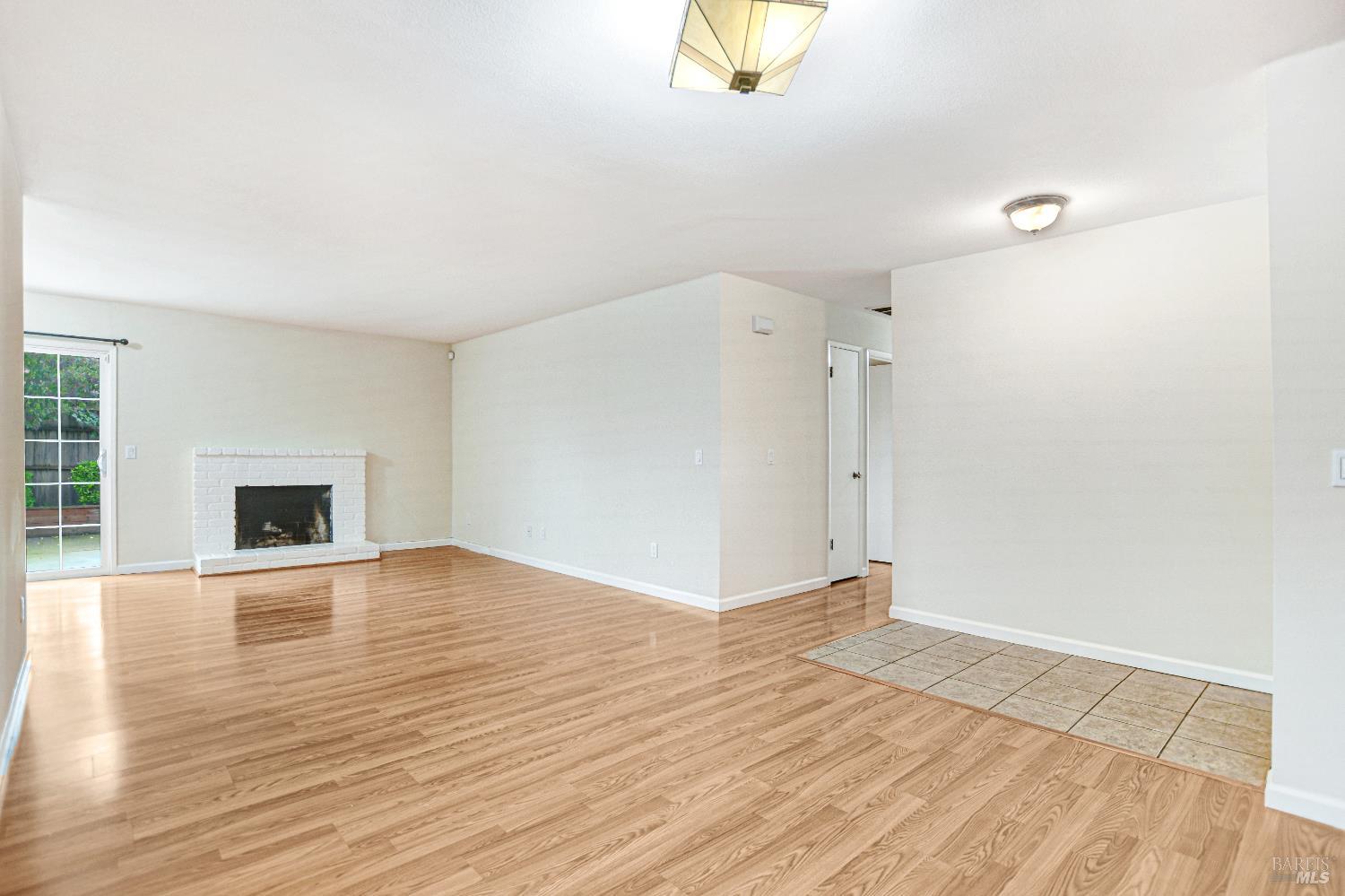 7257 Belita Avenue Rohnert Park, CA 94928 - Photo 10 of 37 a view of an empty room with wooden floor and a window