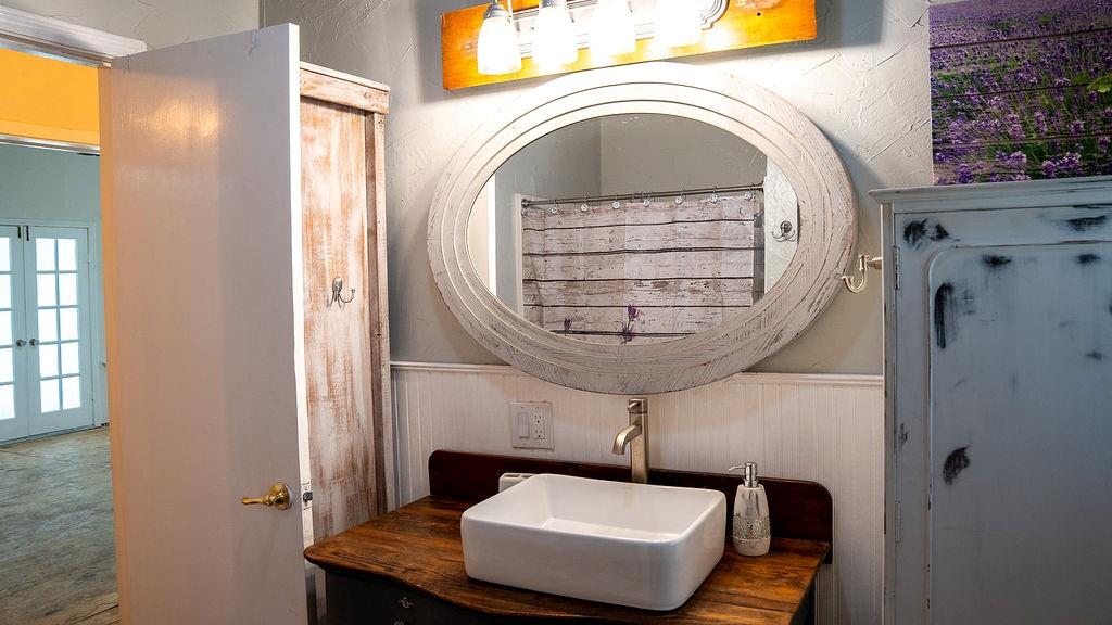 213 County Road 2320 Telephone, TX 75488 - Photo 18 of 40 Vanity and cabinets in the guest bathroom