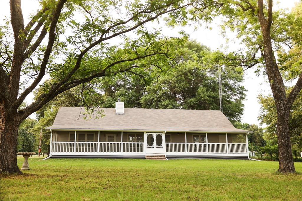 213 County Road 2320 Telephone, TX 75488 - Photo 2 of 40 Home is surrounded by mature trees.
