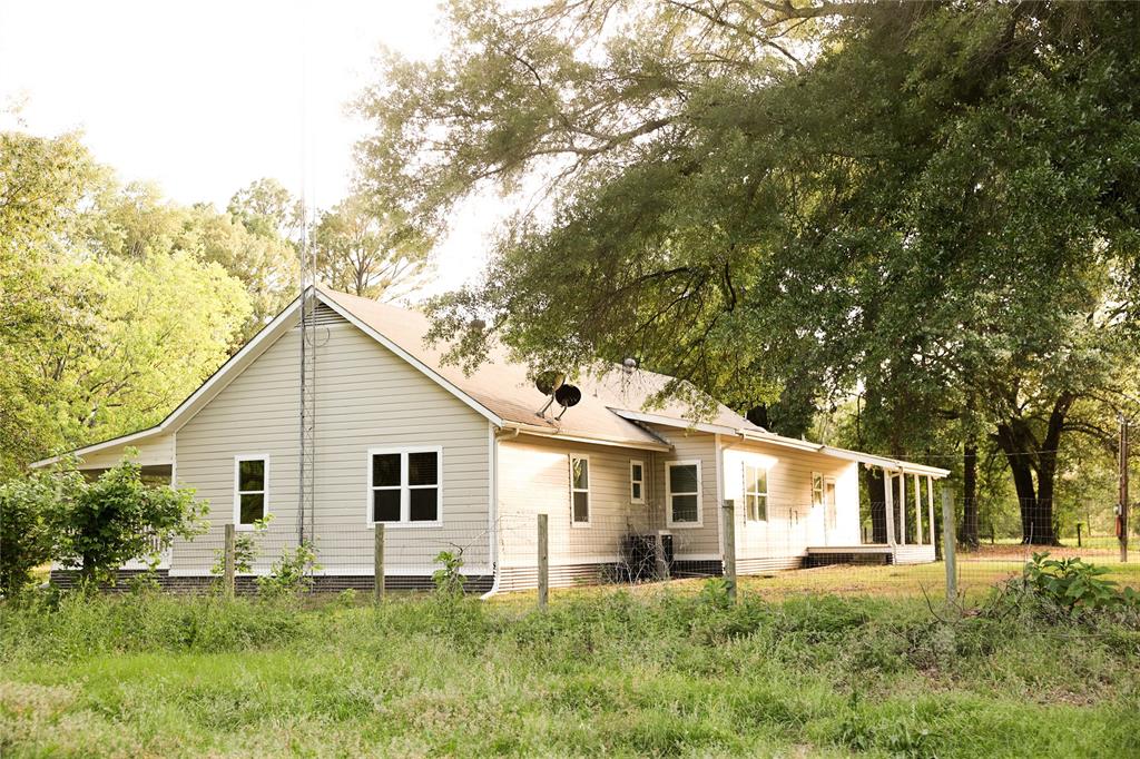 213 County Road 2320 Telephone, TX 75488 - Photo 27 of 40 Mature trees shade the home