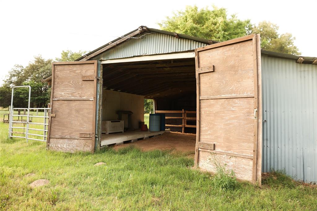 213 County Road 2320 Telephone, TX 75488 - Photo 32 of 40 Barn has four stalls and wood tack and feed area