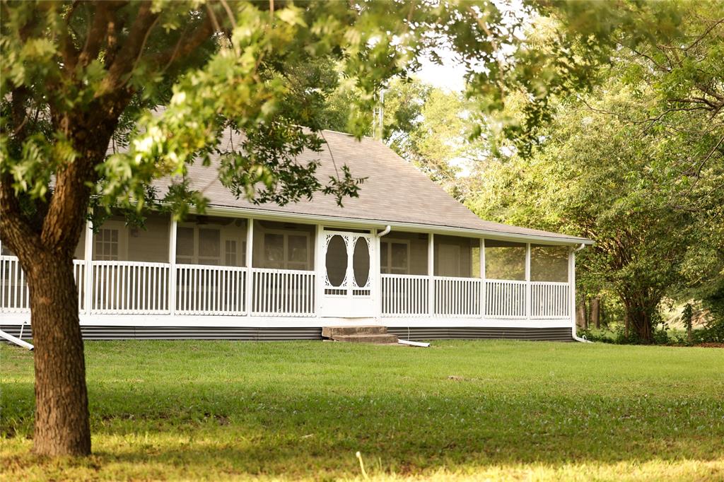 213 County Road 2320 Telephone, TX 75488 - Photo 39 of 40 Front screened porch provides opportunity to enjoy the view year round.