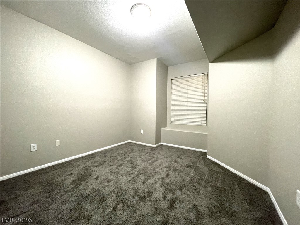 10001 Peace Way, Unit 1327 Las Vegas, NV 89147 - Photo 14 of 21 A well-lit, neutral-toned room provides a blank canvas for personalization and comfort.