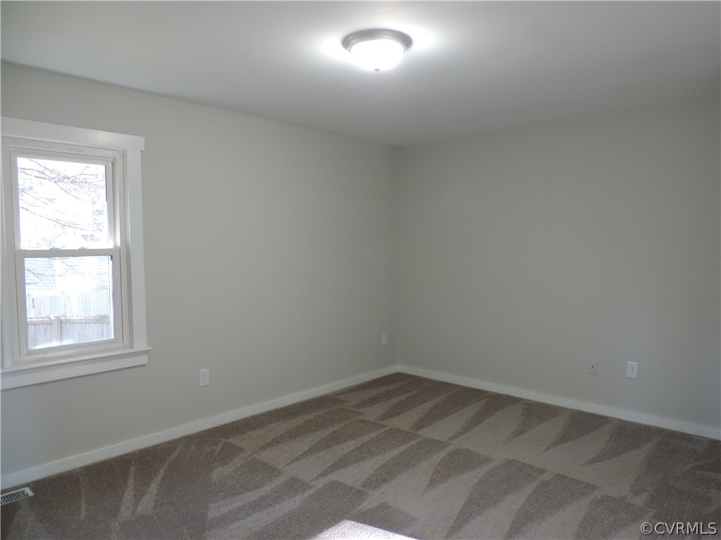 7825 Valencia Road Chesterfield, VA 23832 - Photo 14 of 26 an empty room with a window