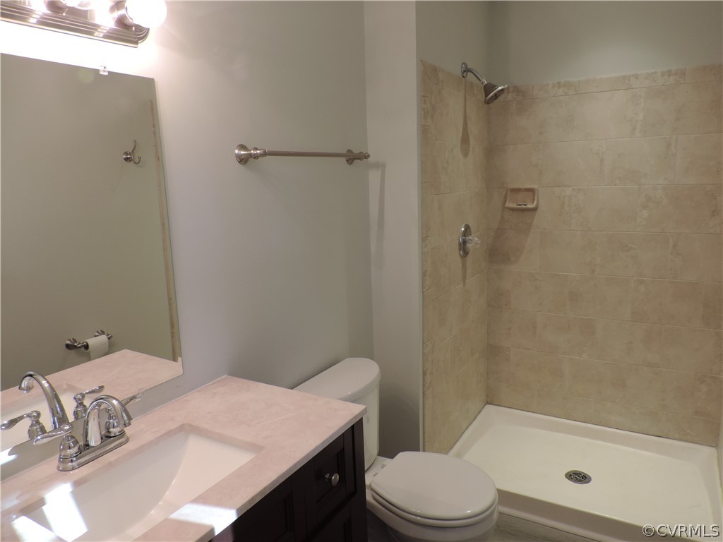 7825 Valencia Road Chesterfield, VA 23832 - Photo 17 of 26 a bathroom with a sink a toilet and shower