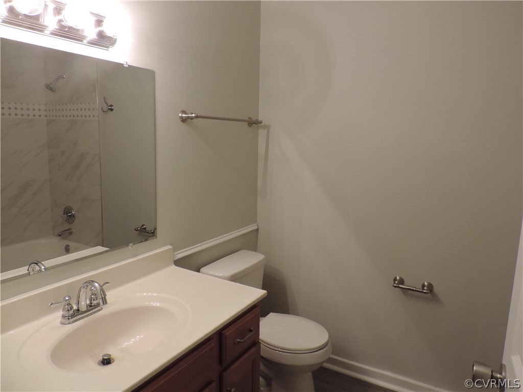 7825 Valencia Road Chesterfield, VA 23832 - Photo 20 of 26 a bathroom with a sink toilet and vanity