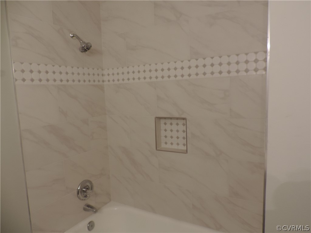 7825 Valencia Road Chesterfield, VA 23832 - Photo 21 of 26 a bathroom with a bathtub and shower