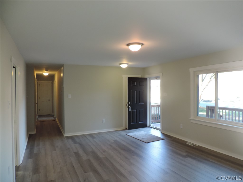 7825 Valencia Road Chesterfield, VA 23832 - Photo 7 of 26 a view of an empty room with wooden floor and a window