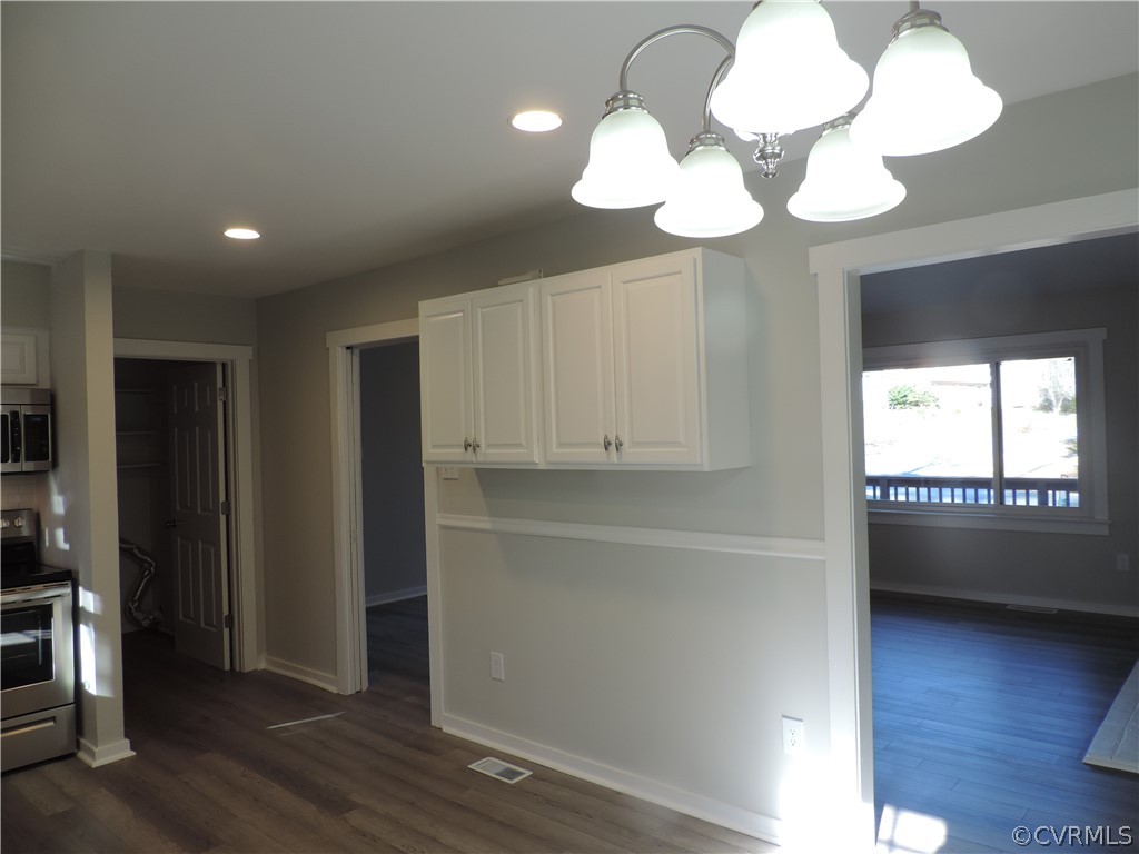 7825 Valencia Road Chesterfield, VA 23832 - Photo 10 of 26 a view of an empty room with wooden floor and a window