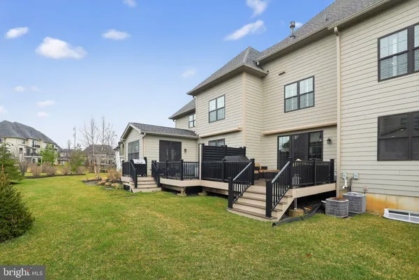 a view of a house with backyard porch and sitting area