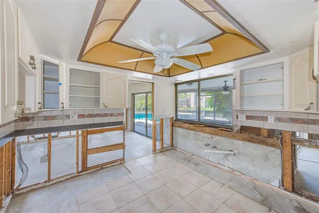 a large bathroom with a large tub and sink