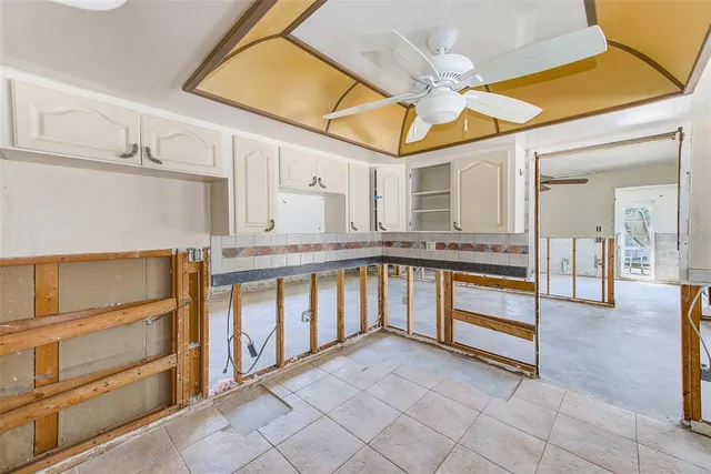 a spacious bathroom with a sink and a mirror