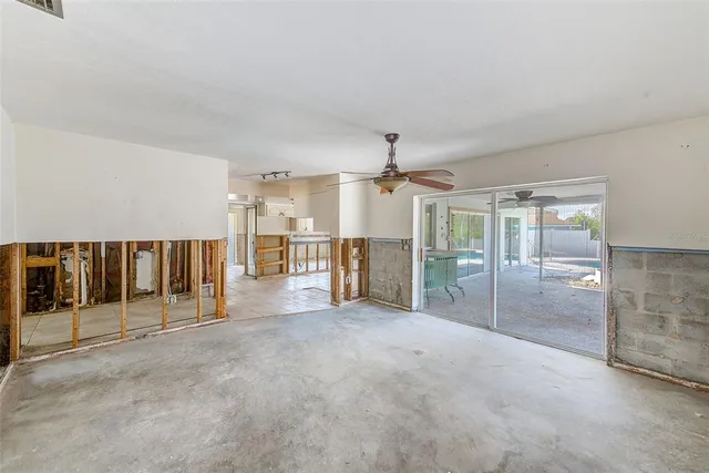 a view of an empty room with stairs