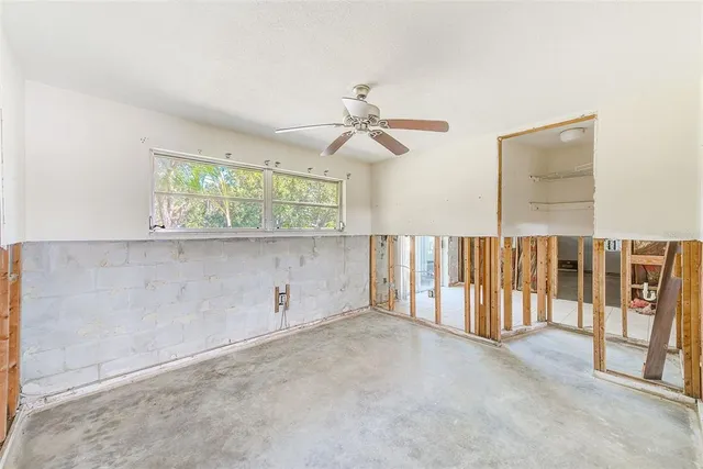 a bathroom with a tub a sink and a shower