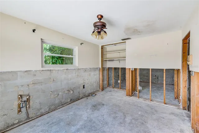 a bedroom with furniture window and a rug