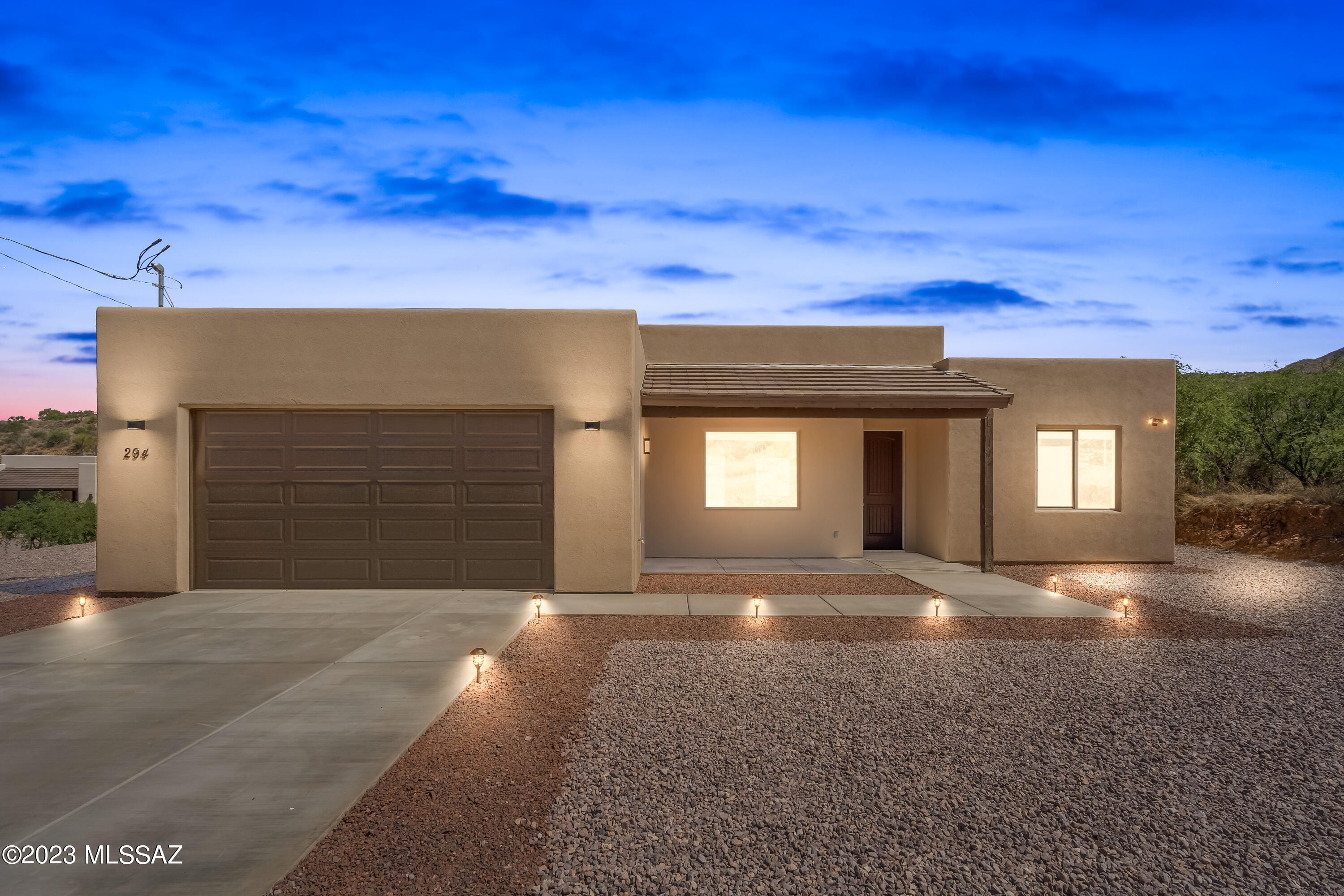 294 Circulo Cerro Rio Rico, AZ 85648 - Photo 2 of 38 a view of a house with a yard and garage
