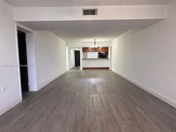 a view of a livingroom with wooden floor
