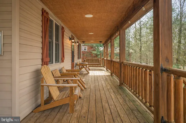 a view of a balcony with chairs