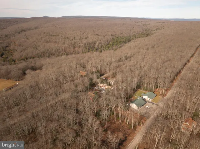 a view of a house with backyard porch and sitting area