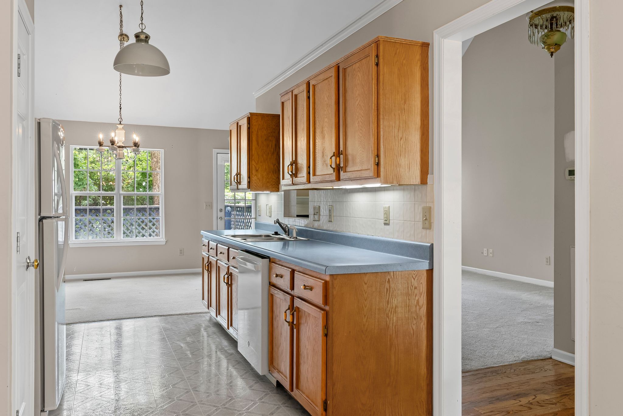 3012 Bent Tree Road Franklin, TN 37067 - Photo 11 of 34 a kitchen with stainless steel appliances granite countertop a stove a sink and a refrigerator