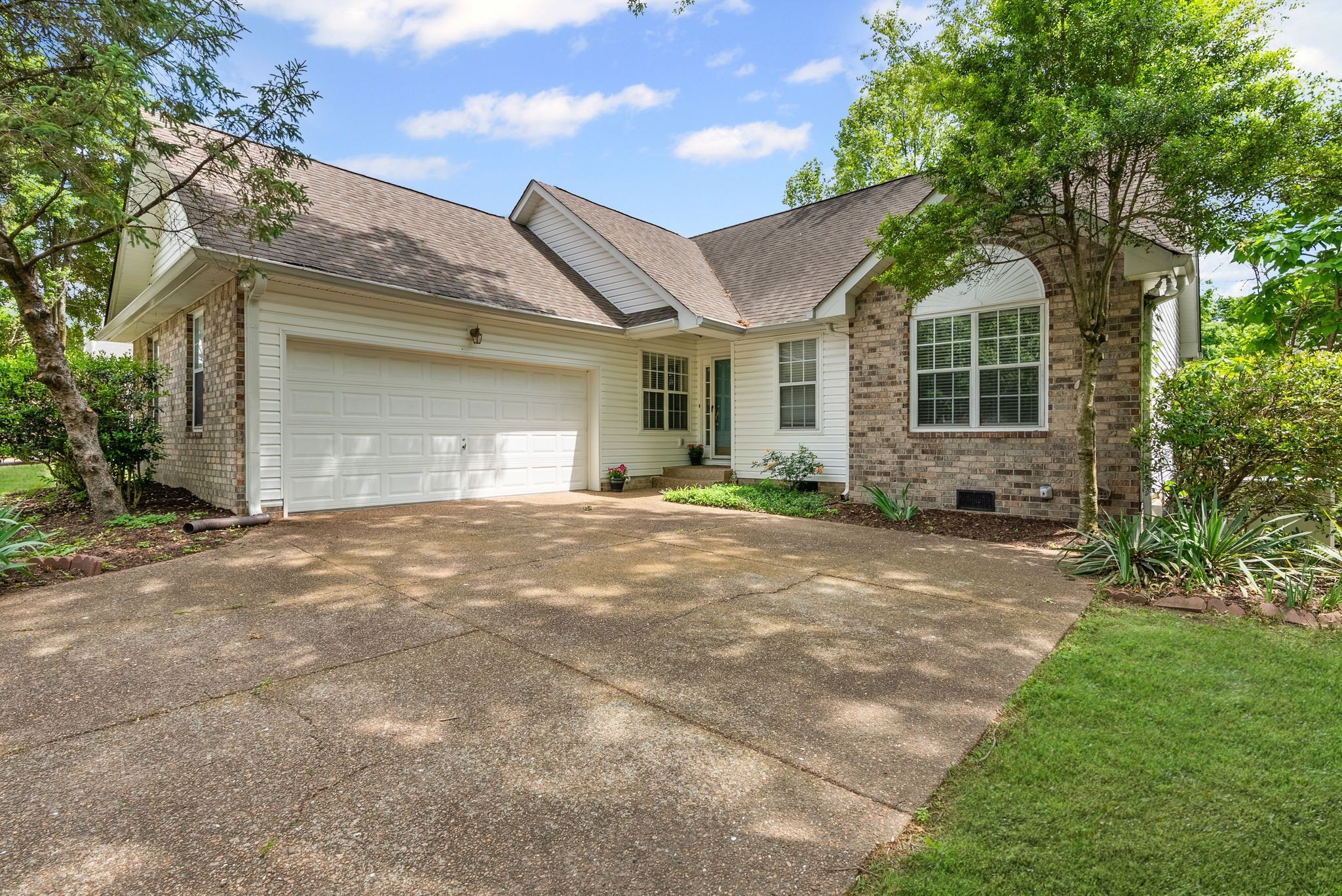 3012 Bent Tree Road Franklin, TN 37067 - Photo 2 of 34 a front view of a house with garden